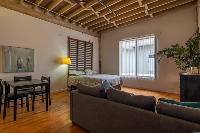 423 E 3rd St Unit 218, Little Rock, AR 72201 - bedroom featuring baseboards and wood finished floors