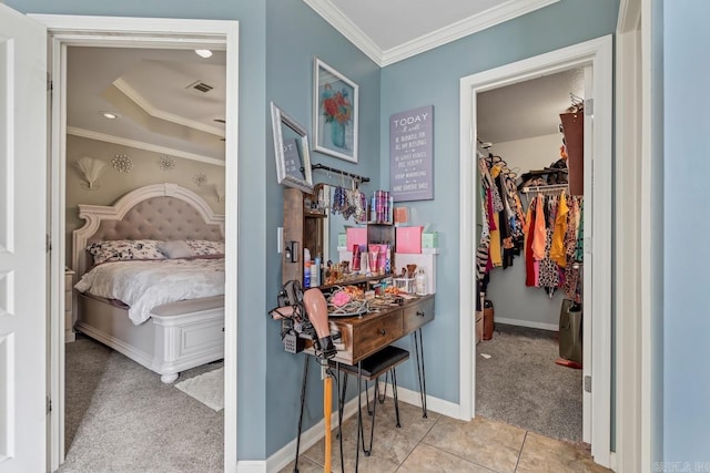 3612 Lexee Dr, Jonesboro, AR 72404 - carpeted bedroom featuring ornamental molding, a walk in closet, a raised ceiling, and a closet