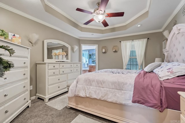 3612 Lexee Dr, Jonesboro, AR 72404 - carpeted bedroom featuring a tray ceiling, multiple windows, ornamental molding, a ceiling fan, and recessed lighting