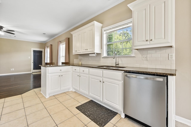 1228 Ridgecrest Dr, Benton, AR 72015 - kitchen featuring stainless steel dishwasher, ornamental molding, backsplash, white cabinets, and healthy amount of natural light