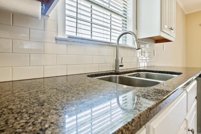 1228 Ridgecrest Dr, Benton, AR 72015 - kitchen featuring white cabinetry, tasteful backsplash, crown molding, and dark stone counters