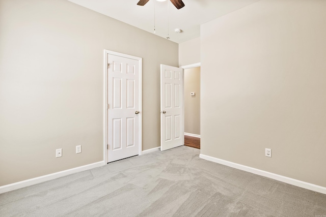1228 Ridgecrest Dr, Benton, AR 72015 - unfurnished bedroom featuring light colored carpet and a ceiling fan