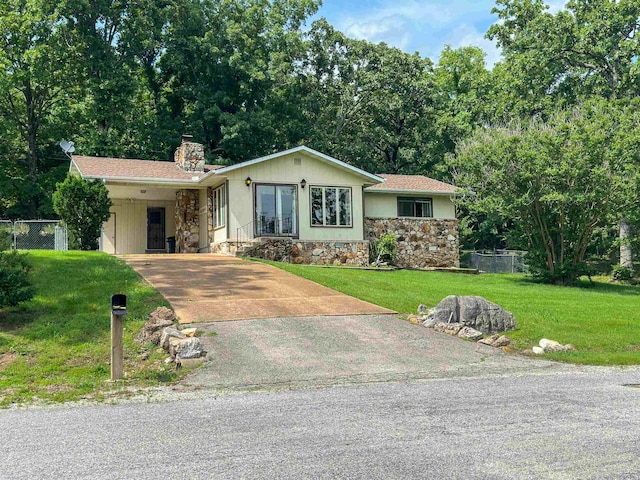 1502 E Emerald Cove Dr, Horseshoe Bend, AR 72512 - single story home with stone siding, driveway, a chimney, and an attached carport