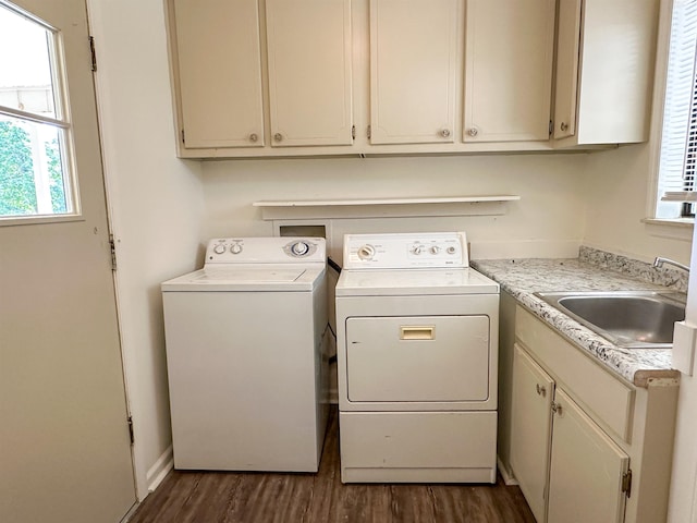 1502 E Emerald Cove Dr, Horseshoe Bend, AR 72512 - laundry area featuring washing machine and dryer, plenty of natural light, dark wood-style flooring, and cabinet space