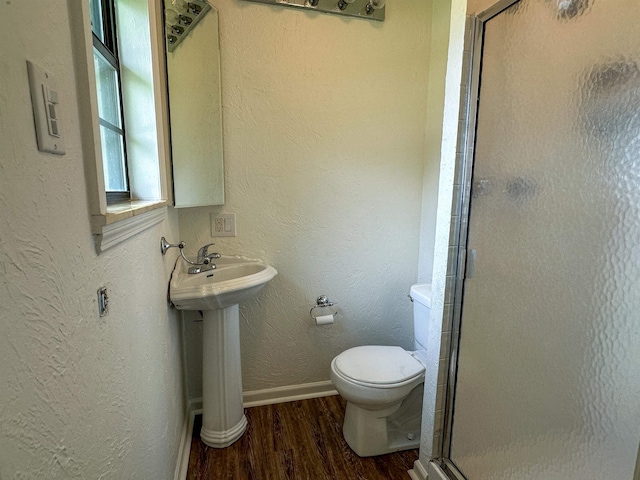 1502 E Emerald Cove Dr, Horseshoe Bend, AR 72512 - bathroom featuring wood finished floors, a shower stall, and a textured wall
