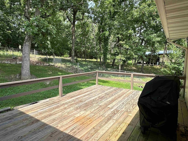 1502 E Emerald Cove Dr, Horseshoe Bend, AR 72512 - wooden deck featuring a grill and view of wooded area