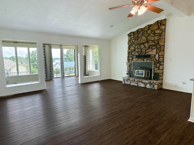 1502 E Emerald Cove Dr, Horseshoe Bend, AR 72512 - unfurnished living room with dark wood finished floors, vaulted ceiling, ceiling fan, and a textured ceiling