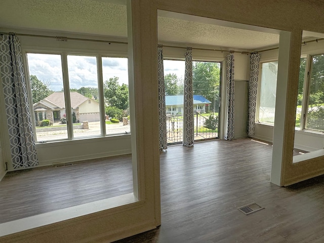 1502 E Emerald Cove Dr, Horseshoe Bend, AR 72512 - entryway with wood finished floors and a textured ceiling