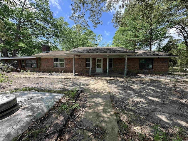 17811 Puckett Rd, Alexander, AR 72002 - back of property with brick siding and a chimney