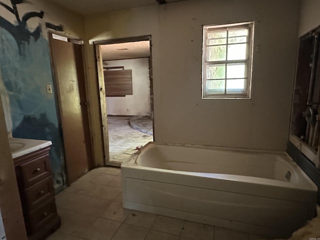 17811 Puckett Rd, Alexander, AR 72002 - bathroom with vanity, a bath, and tile patterned flooring