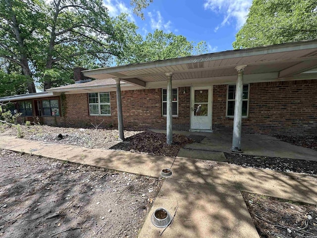 17811 Puckett Rd, Alexander, AR 72002 - doorway to property with brick siding