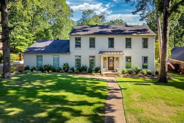 7 Shawbridge Ln, Little Rock, AR 72212 - view of front facade featuring brick siding, a front lawn, and roof with shingles