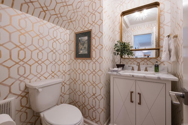 7 Shawbridge Ln, Little Rock, AR 72212 - bathroom featuring wallpapered walls, radiator, ornamental molding, and vanity