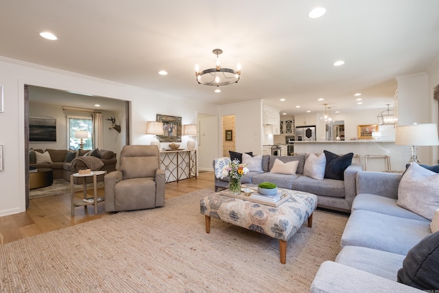 7 Shawbridge Ln, Little Rock, AR 72212 - living room with a chandelier, light wood finished floors, recessed lighting, and ornamental molding