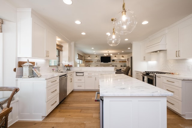 7 Shawbridge Ln, Little Rock, AR 72212 - kitchen with appliances with stainless steel finishes, premium range hood, recessed lighting, open floor plan, and a peninsula