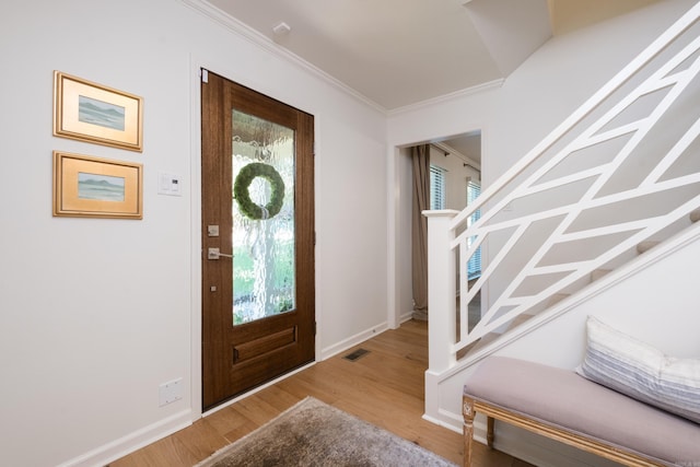 7 Shawbridge Ln, Little Rock, AR 72212 - foyer entrance with plenty of natural light, wood finished floors, and crown molding