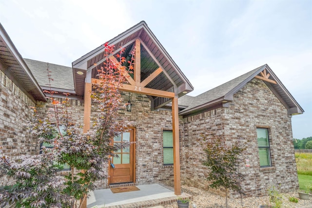 26 Edward Way, Greenbrier, AR 72058 - view of exterior entry with roof with shingles and brick siding