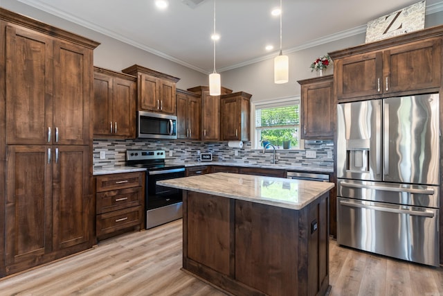 26 Edward Way, Greenbrier, AR 72058 - kitchen featuring appliances with stainless steel finishes, light stone counters, tasteful backsplash, light wood finished floors, and ornamental molding