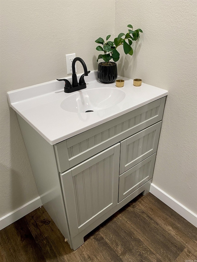 103 S 7th, Coal Hill, AR 72832 - bathroom with wood finished floors and vanity