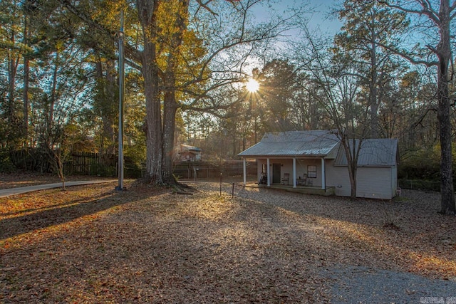 301 W Magnolia St, Rison, AR 71665 - view of front facade featuring a porch and a metal roof