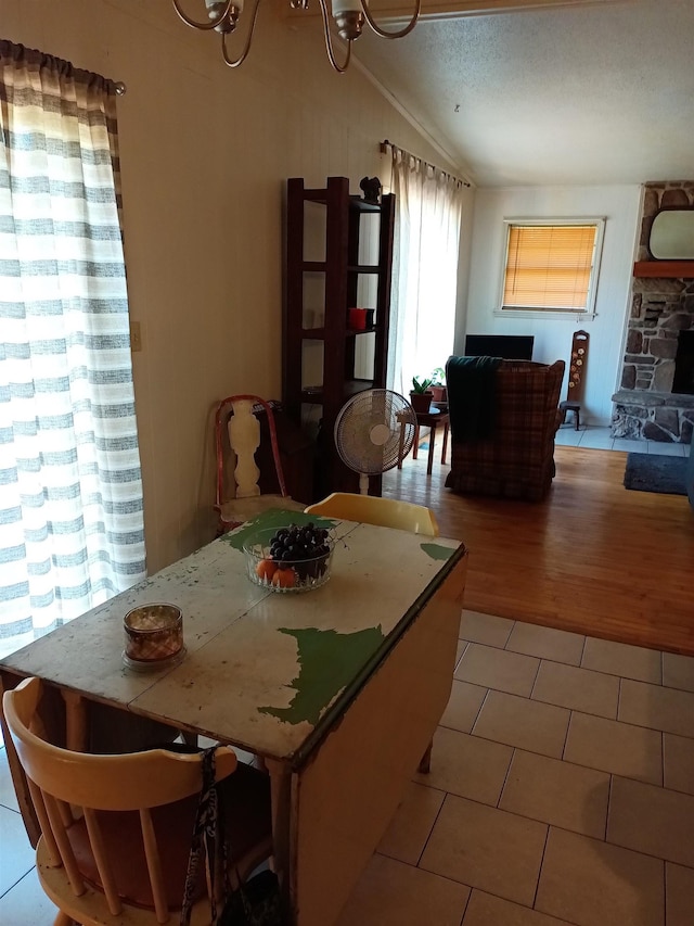 203 Diamond Ln, Horseshoe Bend, AR 72512 - dining room with vaulted ceiling and light tile patterned floors