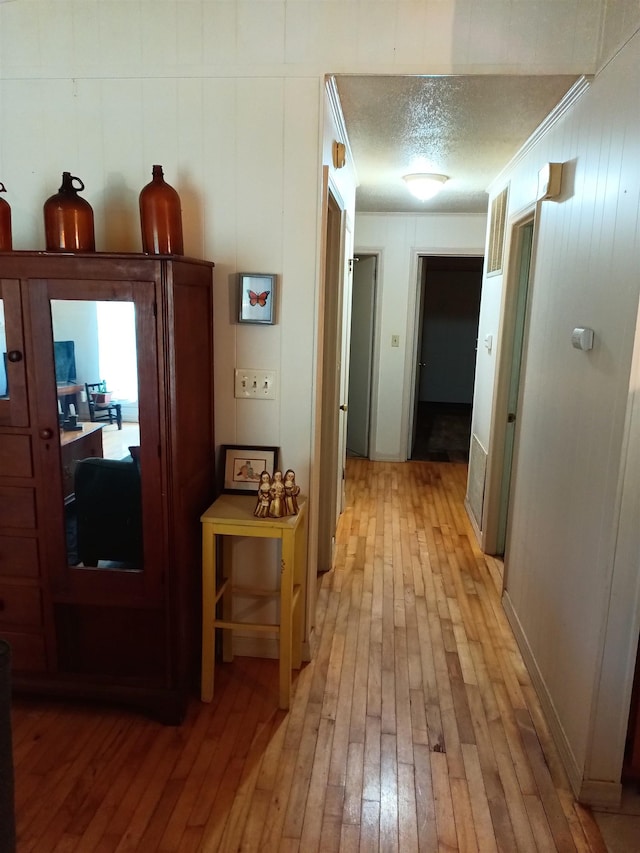 203 Diamond Ln, Horseshoe Bend, AR 72512 - corridor with light wood-style flooring, an office area, and ornamental molding