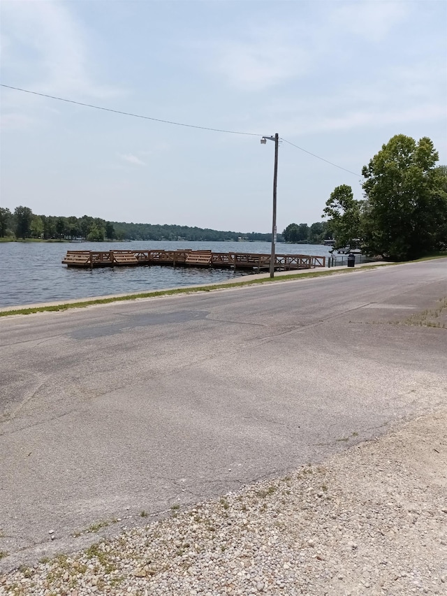 203 Diamond Ln, Horseshoe Bend, AR 72512 - view of asphalt road featuring a water view and street lights
