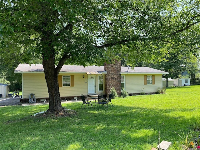 4 Trout, Heber Springs, AR 72543 - back of property with a yard and a chimney