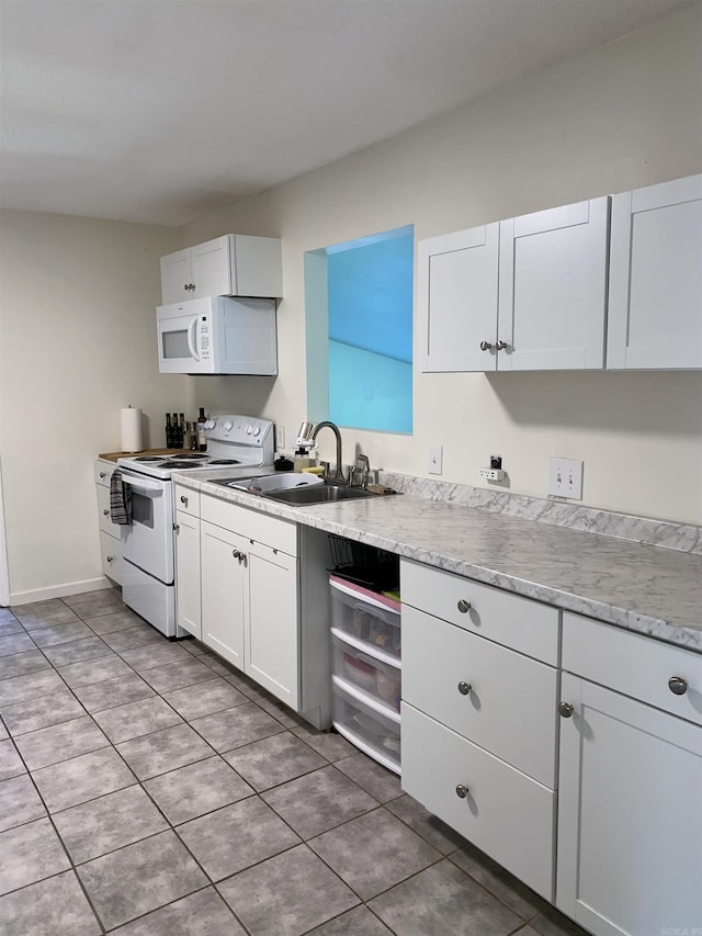 4 Trout, Heber Springs, AR 72543 - kitchen featuring white appliances, white cabinetry, light tile patterned flooring, and light stone countertops