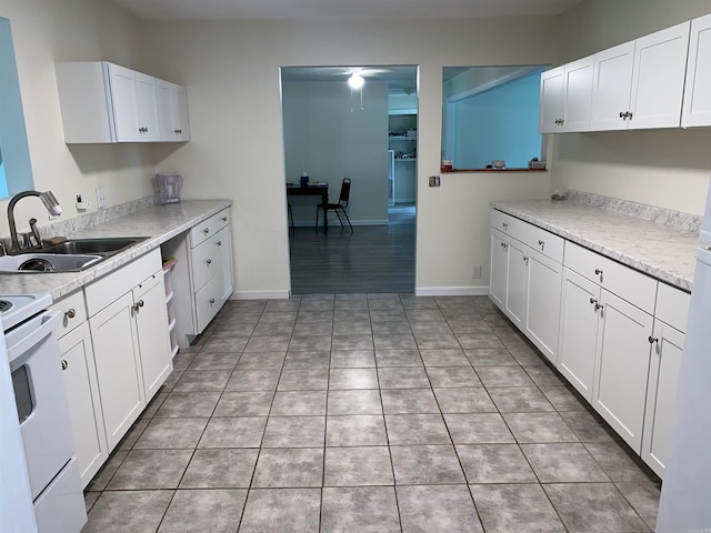 4 Trout, Heber Springs, AR 72543 - kitchen with white cabinetry, light countertops, light tile patterned floors, and white electric stove