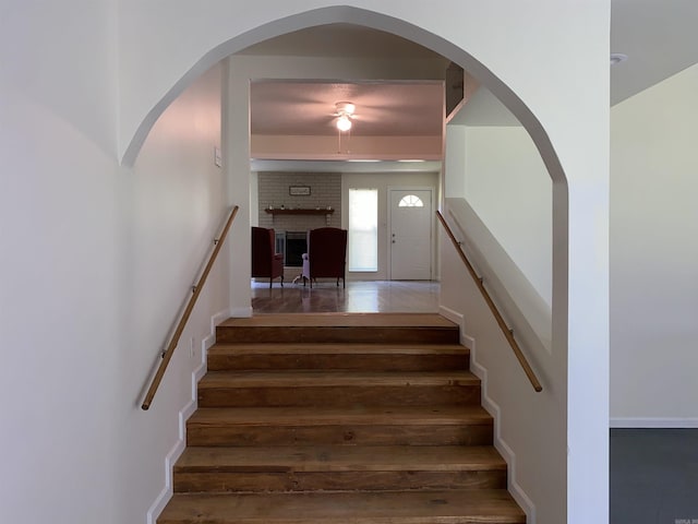 4 Trout, Heber Springs, AR 72543 - staircase with hardwood / wood-style flooring, a fireplace, and ceiling fan