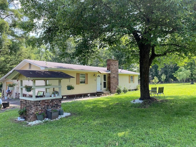 4 Trout, Heber Springs, AR 72543 - view of front of house with entry steps, a chimney, a front yard, and a shingled roof