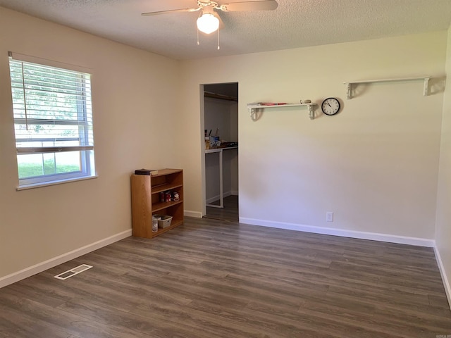 4 Trout, Heber Springs, AR 72543 - unfurnished bedroom with dark wood finished floors, a closet, a textured ceiling, and ceiling fan