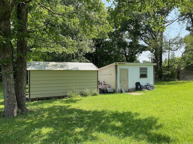 4 Trout, Heber Springs, AR 72543 - view of green lawn featuring a storage unit