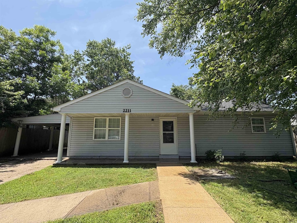 2211 Sutton Dr, Jonesboro, AR 72401 - view of front of property featuring covered porch and a carport