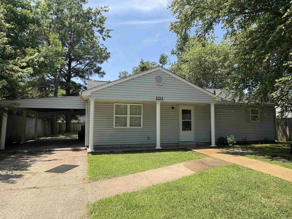2211 Sutton Dr, Jonesboro, AR 72401 - bungalow featuring driveway and a carport