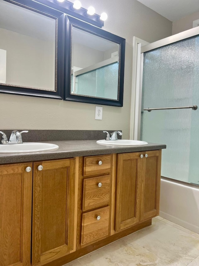 809 Banner St, Benton, AR 72015 - bathroom with double vanity and enclosed tub / shower combo