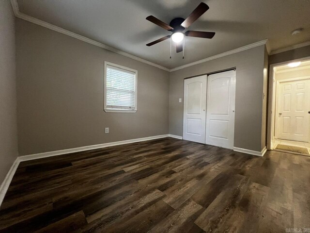 809 Banner St, Benton, AR 72015 - unfurnished bedroom featuring ornamental molding, dark wood-type flooring, a closet, and a ceiling fan