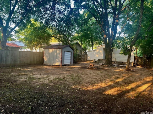 809 Banner St, Benton, AR 72015 - fenced backyard featuring a storage shed