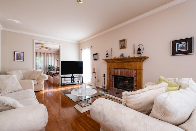 10 Cedar Branch Dr, Little Rock, AR 72223 - living room featuring wood finished floors, crown molding, and a brick fireplace