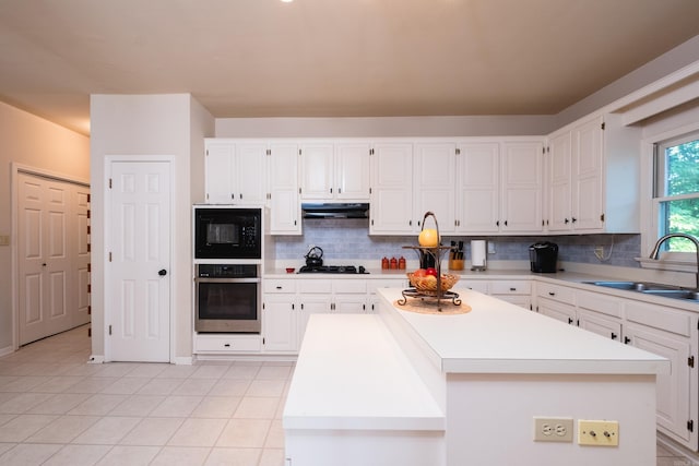 10 Cedar Branch Dr, Little Rock, AR 72223 - kitchen featuring black appliances, white cabinets, and backsplash