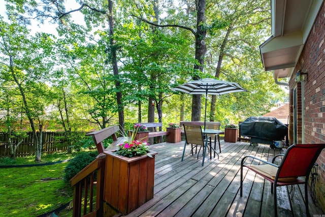 10 Cedar Branch Dr, Little Rock, AR 72223 - wooden terrace with area for grilling and outdoor dining area