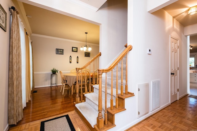10 Cedar Branch Dr, Little Rock, AR 72223 - staircase with ornamental molding and a chandelier