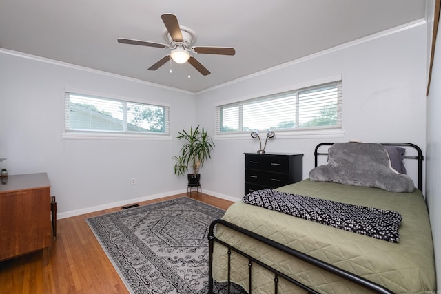 4509 Crestline Dr, North Little Rock, AR 72116 - bedroom with wood finished floors, ornamental molding, and a ceiling fan