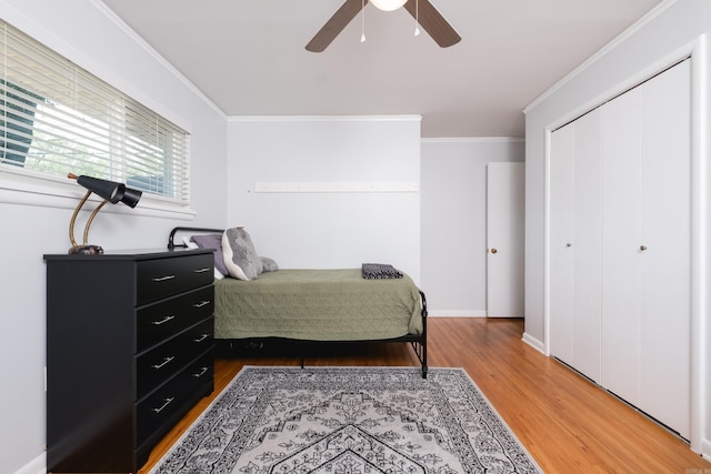 4509 Crestline Dr, North Little Rock, AR 72116 - bedroom with light wood finished floors, ornamental molding, a closet, and a ceiling fan