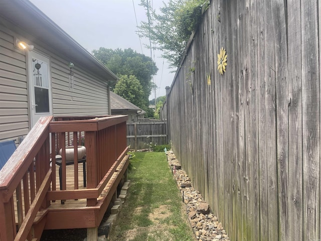 view of yard with a wooden deck
