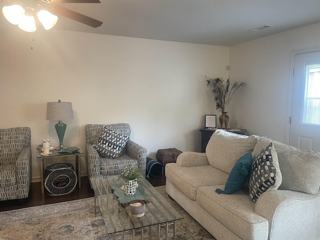 living room with ceiling fan and wood finished floors