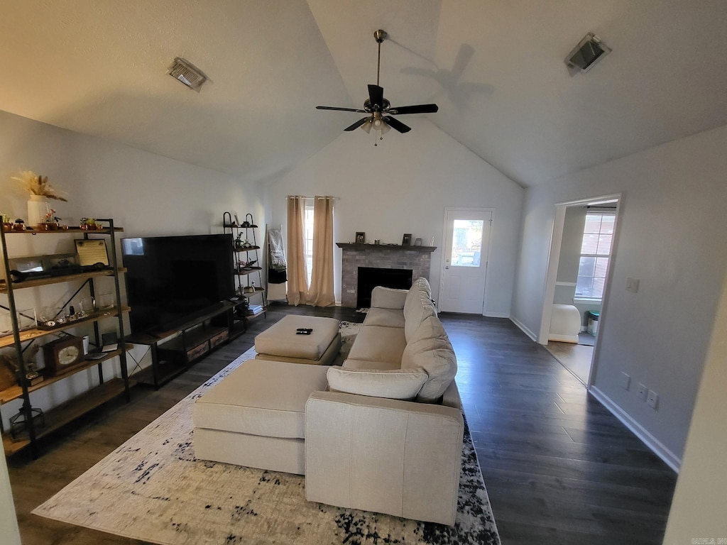 19 Timber Ln, Cabot, AR 72023 - living room featuring a ceiling fan, lofted ceiling, a fireplace, and dark wood finished floors
