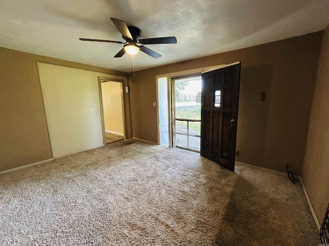 110 Saint Vincent St, Morrilton, AR 72110 - carpeted foyer featuring ceiling fan and baseboards