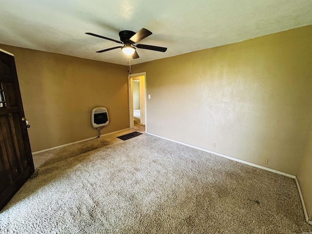 110 Saint Vincent St, Morrilton, AR 72110 - carpeted spare room featuring heating unit and a ceiling fan